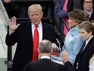 Donald Trump is sworn in as the 45th president of the United States by Chief Justice John G. Roberts Jr. as Melania Trump looks on during the 58th Presidential Inauguration at the U.S. Capitol in Washington, D.C. 