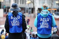 Legal observers with the American Civil Liberties Union watch as students protest in Portland, Ore., last month. Since the beginning of President Donald Trump’s administration, the ACLU has been flooded with donations to bolster legal challenges toward several White House policies. 