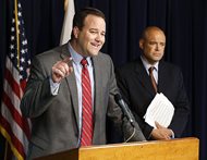 State Sen. Matthew J. Murphy (left), a Palatine Republican, speaks as Republican Rep. Ronald L. Sandack of Downers Grove listens behind him during a news conference on June 25, 2014, in Chicago. Murphy announced he will leave the legislature next month, just weeks after Sandack left his post in the House. 