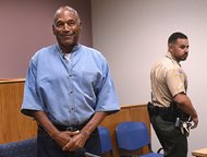 Former NFL football star O.J. Simpson enters for his parole hearing at the Lovelock Correctional Center in Lovelock, Nev., on July 20. Simpson was convicted in 2008 of enlisting some men he barely knew, including two who had guns, to retrieve from two sports collectibles sellers some items that Simpson said were stolen from him a decade earlier. 