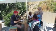 Duane F. Sigelko (left), a partner at Reed Smith LLP, volunteers by helping asylum-seekers prepare for interviews at a refugee camp in Greece. 