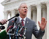 In a Feb. 26 file photo, Gov. Bruce Rauner speaks to the media outside the Supreme Court, in Washington, D.C. Rauner vetoed legislation that would require gun retailers to be licensed by the state of Illinois today. Chicago Mayor Rahm Emanuel backed the measure. He said Rauner is putting the primary election ahead of his responsibility for public safety.