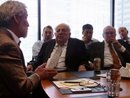 Abner Mikva (center) and Newt Minow (right) listen as Jamie Kalven of the Invisible Institute (left) recounts his reporting on the 2014 shooting of Laquan McDonald by Chicago police officer Jason Van Dyke during the Public Affairs Roundtable on Jan. 21. The invitation-only roundtable events are held at the offices of Miller, Shakman & Beem LLP. 