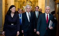 President Donald Trump's nominee for the Supreme Court Judge Neil M. Gorsuch, center, arrives in the Capitol flanked by former Sen. Kelly Ayotte, R-N.H., left, and Vice President Mike Pence as they head to their meeting with Senate Majority Leader Mitch McConnell, R-Ky., today. 