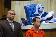 Larry Nassar, right, listens to Judge Janice Cunningham on Monday, the third and final day of sentencing in Eaton County Court in Charlotte, Mich.. She sentenced him to 40-125 years in prison on three counts of sexual assault. Seated next to him is his attorney Matt Newburg.