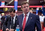 Then-Trump Campaign Chairman Paul Manafort walks around the convention floor before the opening session of the Republican National Convention last month in Cleveland. The longtime political consultant quit the campaign today after details emerged of his ties to pro-Russian officials in Ukraine where he was an adviser to the former president. 