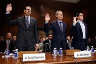 (From left) AT&T Chairman and CEO Randall Stephenson, Time Warner Chairman and CEO Jeffrey Bewkes and AXS TV Chairman and Dallas Mavericks owner Mark Cuban are sworn in on Capitol Hill this morning prior to testifying before a Senate Judiciary subcommittee hearing on the proposed merger between AT&T and Time Warner. 