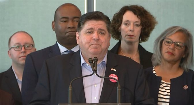 Gov. J.B. Pritzker speaks at a news conference Tuesday in Chicago with members of the Democratic National Committee in an attempt to land the 2024 DNC convention for the city of Chicago. At far right is U.S. Rep Robin Kelly, who chairs the state’s Democratic Party.