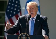 President Donald Trump speaks during a Rose Garden news conference at the White House Monday. Trump says Democrats are holding up his judicial nominees, but almost nine months into his presidency he has had more judges confirmed than President Barack Obama did in the same time period. And his numbers aren’t far off those of other recent presidents. 