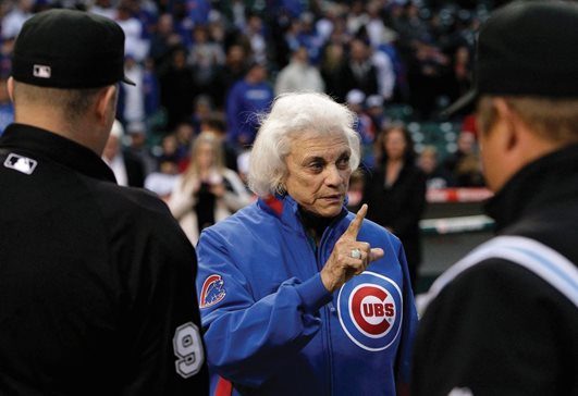 Retired U.S. Supreme Court Justice Sandra Day O'Connor, who visited Chicago in 2010, reminds the umpires to be fair after delivering the first ball to the crew before a game between the Chicago Cubs and Colorado Rockies at Wrigley Field. Legal leaders spoke of her influence after her death Friday.