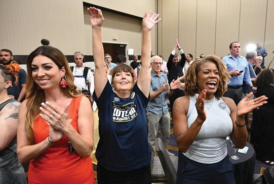 Voters applaud during a primary watch party Tuesday in Overland Park, Kansas. Voters in the conservative state rejected a ballot measure that would have allowed the Republican-controlled Legislature to tighten restrictions on abortion or ban it outright.