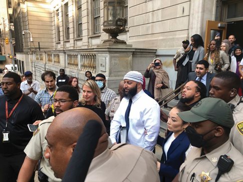 Adnan Syed, center, leaves the Elijah E. Cummings Courthouse in Baltimore Monday after a judge   overturned his conviction for a 1999 murder that was chronicled in the hit true-crime podcast “Serial.”  AP Photo/Brian Witt
