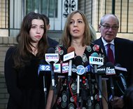 Patti Blagojevich (center) stands next to her daughter, Amy, during a news conference Tuesday where she expressed disappointment in the federal appeals court ruling. She said her husband, former Gov. Rod Blagojevich, is still hopeful that “justice will prevail eventually” as he is serving a prison term for convictions related to public corruption. The court vacated five of the 18 convictions and ordered a new sentencing hearing. But the court said its ruling doesn’t necessarily mean the ex-governor’s prison term should be reduced.