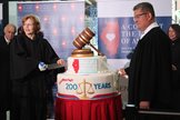 Chief U.S. District Judge Ruben Castillo and Judge Rebecca R. Pallmeyer cut a giant cheesecake and a March 1 ceremony in the Dirksen Building lobby.