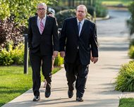 Lake County, Ind., Sheriff John Buncich (right) and his attorney, Bryan Truitt of Bertig & Associates in Valparaiso, arrive at federal court in Hammond, Ind on Aug. 7. Federal jurors in Hammond convicted Buncich today, Aug. 24, in a fraud and bribery trial involving an illegal towing scheme. Buncich is free on bond until sentencing Dec. 6 and is immediately removed from office. He was charged with wire fraud, bribery and other counts. 