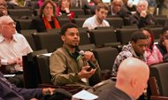Jamel Triggs talks about youth-police relations at a University of Chicago Law School conference on Friday. Triggs, a youth mentor and mechanical instructor at Blackstone Bicycle Works, later served as a panelist. 