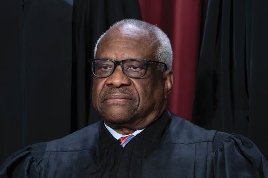 Supreme Court Associate Justice Clarence Thomas was back on the bench Tuesday after an unexplained one-day absence. He joined the other justices in questioning whether federal prosecutors went too far in bringing obstruction charges against hundreds of participants in the Jan. 6 Capitol riot. AP Photo/J. Scott Applewhite, File
