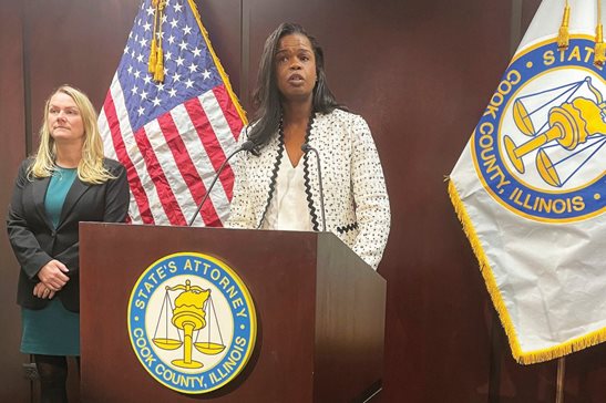 Cook County State's Attorney Kim Foxx, at lectern, announced Monday she is dropping sex abuse charges against singer R. Kelly, who is serving a 30-year prison sentence in a New York case and awaits sentencing Feb. 23 in Chicago federal court.