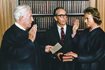  Justice Sandra Day O'Connor, the first female justice of the U.S. Supreme Court, is sworn in by Chief Justice Warren Burger in the court's conference room in Washington, Sept. 25, 1981. Justice O'Connor's husband John holds two family Bibles. The White House via AP