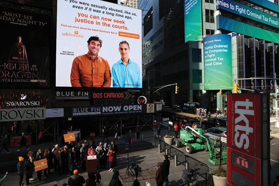A Safe Horizon PSA about the Adult Survivors Act plays in Times Square during a news conference on the new law Friday in New York. Sexual assault victims in New York will get a one-time opportunity to sue their abusers starting Thursday under a new law expected to bring a wave of litigation.