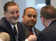 Former Chicago transportation official John Bills (left) arrives at the Dirksen Federal Courthouse on Jan. 11 for the start of his bribery trial. A jury today convicted Bills of accepting hundreds of thousands of dollars in cash and gifts to steer more than $100 million to Phoenix-based Redflex Traffic Systems Inc. 