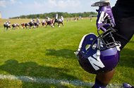 Northwestern University football players run through drills Monday at practice at the University of Wisconsin-Parkside campus in Kenosha, Wis. The same day, the National Labor Relations Board ruled that the players don’t qualify as school employees for the purposes of forming a union.